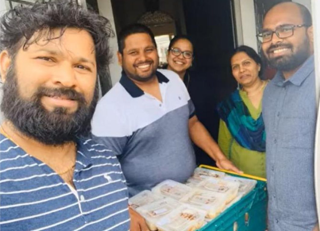 Volunteers distributing prasadam meals