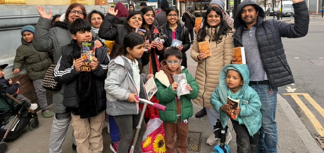 Devotees distributing books on a high street